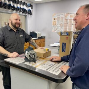 electric motor expert helping a customer